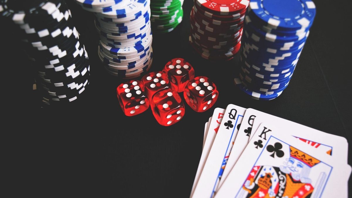 Casino chips, dice and playing cards on a table